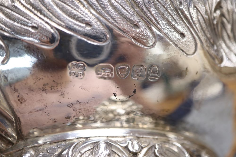 A George IV embossed silver squat circular teapot by Emes & Barnard, London, 1822,